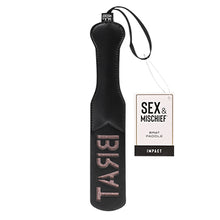 Load image into Gallery viewer, Sportsheets brat impression spanking leather-look paddle lying flat with the brat impression facing upwards and the label attached to the paddle hanger