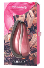 Load image into Gallery viewer, Packaging for the Pink Womanizer LIberty rechargeable air pressure vibrator sex toy with removable silicone cap and storage lid. Usb rechargeable and fully waterproof 