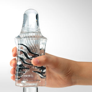 Photo of the Tenga Crysta Leaf stroker being used on a glass dildo.