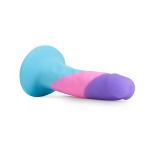 Side view of the Avant Vision of Love 100% silicone blue pink purple striped dildo with a wide suction cup base on white background