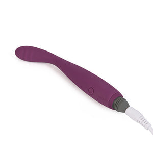 The Svakom Cici body safe silicone vibrator is charging with its USB charging cable