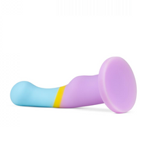 Load image into Gallery viewer, Avant heart of gold realistic silicone purple gold blue dildo with balls and suction cup base lying on side on white background