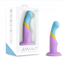 Load image into Gallery viewer, Two Avant heart of gold realistic silicone purple gold blue dildos with balls and suction cup base in packaging and standing upright on white background