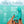 Packaging of the Skins touch rabbit vibrating sex toy in teal, featuring a picture of it being held up against a teal background, with a finger pulling back on the flexible clitoral stimulator, as well as additional information.