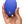 A hand holding a small, oval-shaped blue personal massager against a plain white background.