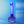 Blue dildo from Strap-on-Me with internal LED lights on a reflective surface with a gradient blue background