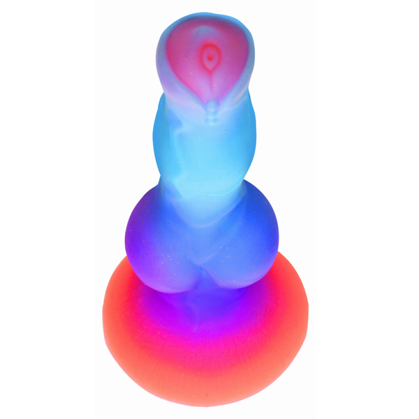 An above view of the vertical silicon textured alien dildo in orange/purple/blue colour scheme.
