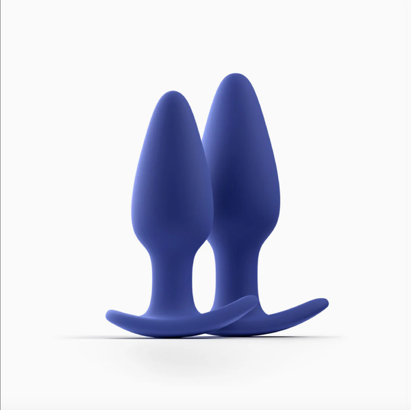 Photo of Biird Regii silicone butt plug set in navy blue on a white background.