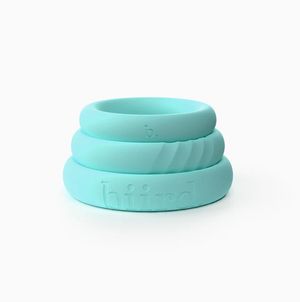 Biird Riin Silicone Cock Ring Set stacked on top of each other in light blue.