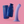 Biird Surii Silicone Suction Cup Dildo shown in lilac on a pink background, alongside navy blue bag & container. 