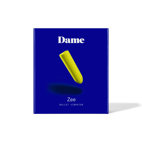 Packaging of Dame Zee bullet sex toy in lime on a navy blue background.