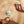 Two hands demonstrating the Ohnut on a glass object.