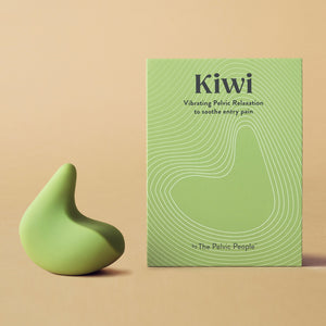 Kiwi therapeutic pelvic health vibrator next to its green box in front of a peach coloured background
