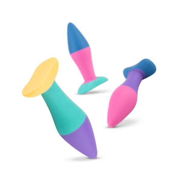 action photo of 3 different sized butt plugs falling and bouncing on white background