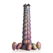 Load image into Gallery viewer, The Creature Cocks tentacle ovipositor dildo standing up on it&#39;s suction cup base surrounded by 5 silicone eggs.