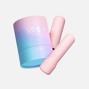 VUSH Gloss Rechargeable Bullet Vibrator in light pink, shown with its cap and its case. 