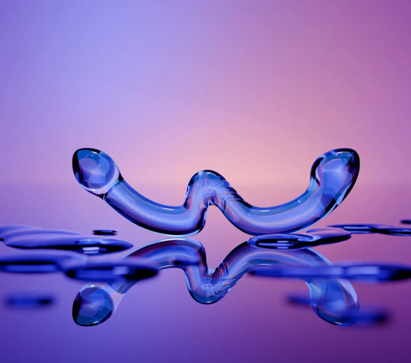 Biird Ohwii Luxury Glass Double Dildo coloured blue on a multicoloured background surrounded by droplets of water and its own reflection.