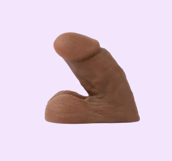 Side view of the Wet For Her Hunter Packer in the colour espresso with realistic veins and testicles