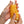 Two hands holding up a Tenga Arte Weave, yellow/orange theme.