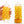 Side view of two Tenga Arte Weave out of their packaging, yellow/orange theme. One is being held by a hand with lubrication, the other is on its stand.