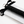 Close up of the tyre tread spanking paddle handle with a metal loop to hang up the paddle and affixed bow in its packaging - Sex Siopa stocks Ireland's best sex toys, lubricants and accessories. 