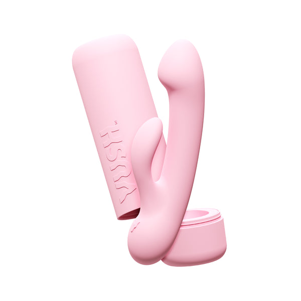 Vush Glow Rechargeable Mini Rabbit Vibrator in pink, alongside its case, on a white background