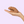 hand holiding the Wet For Her Quinn packer in front of a lavender background