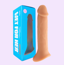 Load image into Gallery viewer, The Wet For Her pack n' play dildo in cream stands next to it's blue cardboard packaging.