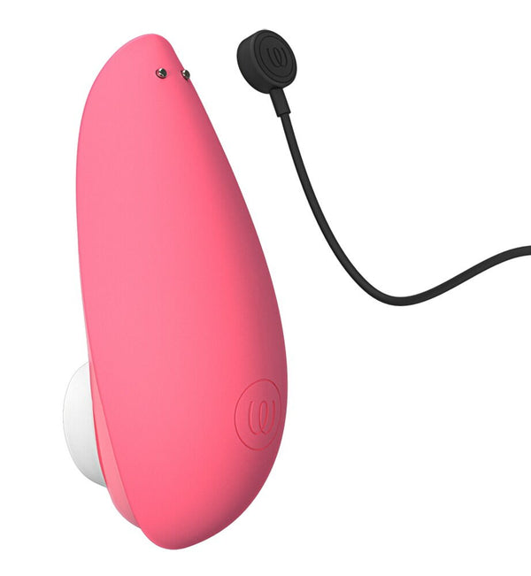 Rear view of the Womanizer Liberty 2 Rechargeable "Sucking" Vibrator in shades of pink and white as well as the black charging cable.