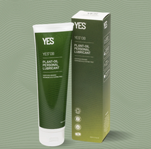 Load image into Gallery viewer, A 140ml bottle of Yes OB plant oil based lubricant next to an example of it&#39;s green cardboard packaging.