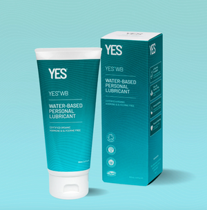 A 150ml tube of Yes water based organic lubricant for menopause and vaginal dryness. Stood vertically next to its packaging with a light blue blackground.
