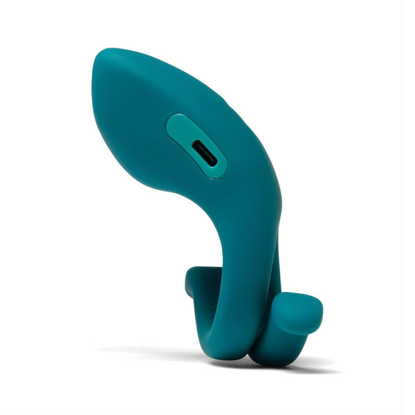 side view of a teal  vibrating cock ring on a white background
