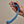 a hand holds the Svibe Snail Axi in front of a beige background.