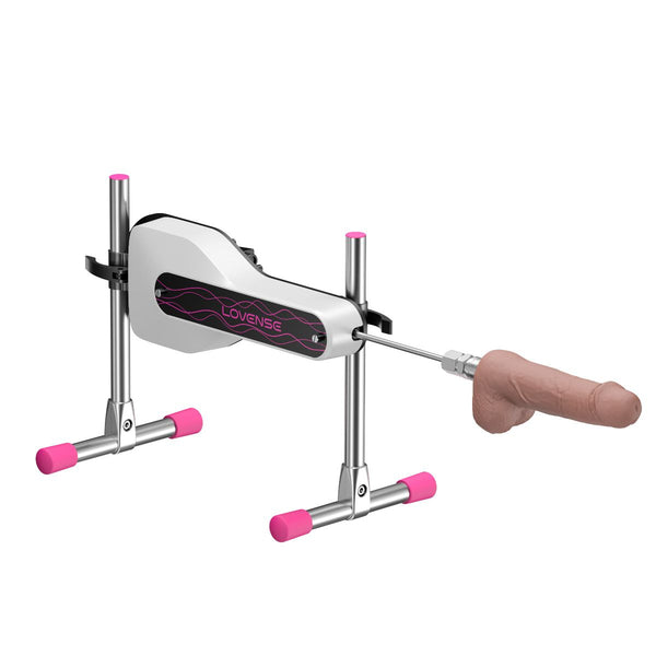 Side view of Lovense mini sex machine with a flesh coloured dildo on a metallic stand