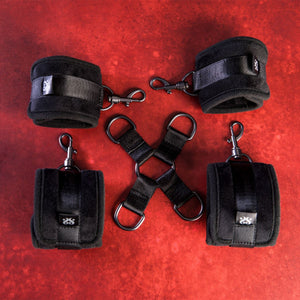 Flat lay of all 5 unassembled pieces of the Sei Mio Hog Tied and Satisfied bondage kit.