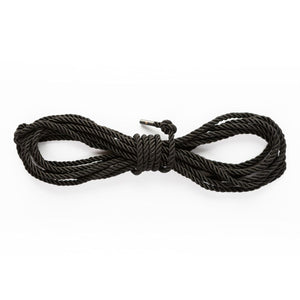 Wrapped up SEI MIO - Knot in Control - 10m Silky Bondage Rope in black on a white background.