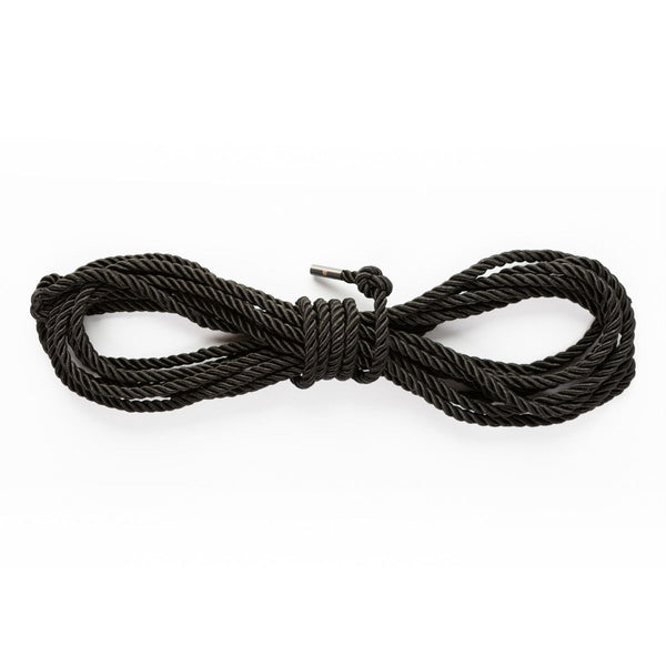 Wrapped up SEI MIO - Knot in Control - 10m Silky Bondage Rope in black on a white background.