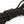 Close up of the texture of a wrapped up SEI MIO - Knot in Control - 10m Silky Bondage Rope in black on a white background.