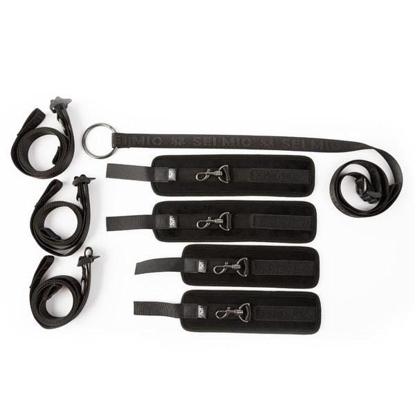 Sei Mio Bed-Spreader Under Bed Restraint System components in black, laid out separately on a white background