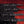 Clip components of the Sei Mio Bed-Spreader Under Bed Restraint System in black, laid out on a red background