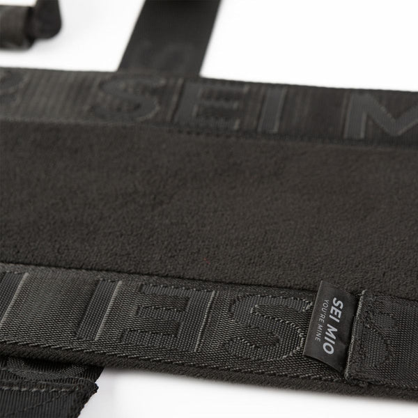 Close up of the texture and material of the SEI MIO - Behind Closed Doors - Adjustable Door Hanging Sex Swing in black on a white background.