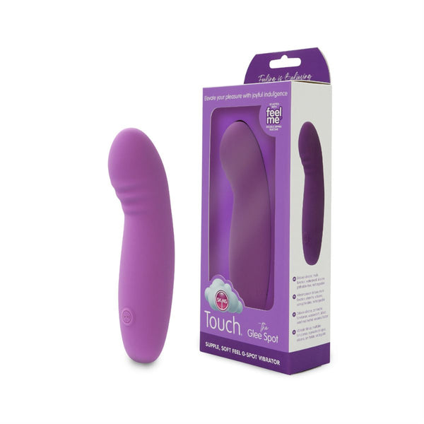 The glee spot rechargeable vibrator by Skins in purple next to its cardboard packaging