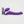 Purple vibrating strapless strap-on dildo with remote control on a white background