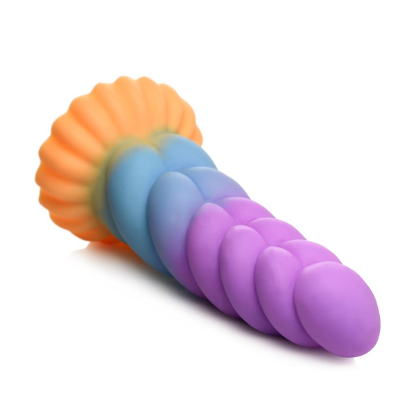 Aerial sideways view of the horizontal ribbed Mystique Unicorn Silicone Dildo in a pink/blue/orange colour scheme.