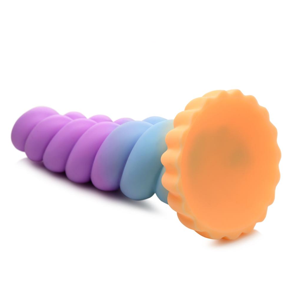 Sideways view of the horizontal ribbed Mystique Unicorn Silicone Dildo in a pink/blue/orange colour scheme. Close up of the textured base in orange.