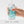 Hand cleaning the Tenga Spinner, a masturbator sex toy for men. Clear toy with turquoise swirls, with water dripping on a white background - Sex Siopa Ireland's favourite adult shop