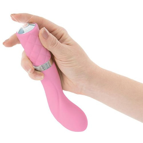 View of a hand pressing the controls at the base of a pink Pillow Talk rechargeable g-spot vibrator - Sex Siopa, Ireland's best adult shop.