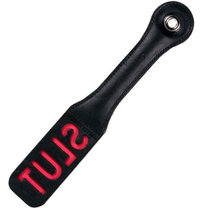 Sportsheets leather BDSM Slut paddle in black with red writing. Paddle on a white background.