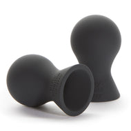Two 50 Shades of Grey 100% silicone nipple suckers side by side on white background