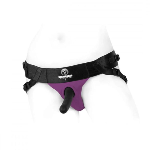 Picture of the Spareparts Joque strapon harness with 2 fully adjustable straps and flexible O-ring in black with a purple crotch, shown on a white mannequin wearing a black dildo. The Joque Harness is made from breathable, moisture wicking poly spandex and is machine washable. Dildos and other sex toys sold seperately. - Sex Siopa Ireland